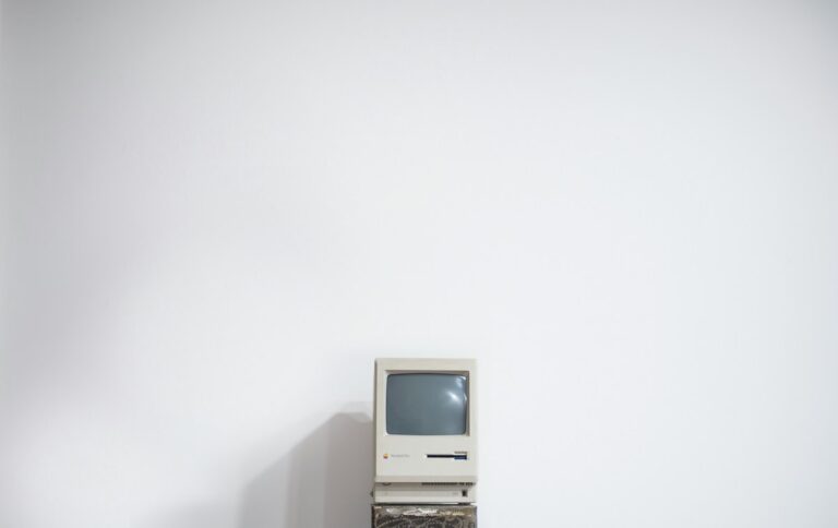 old Apple desktop computer against white background