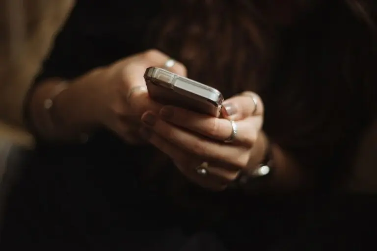 female hands holding mobile phone